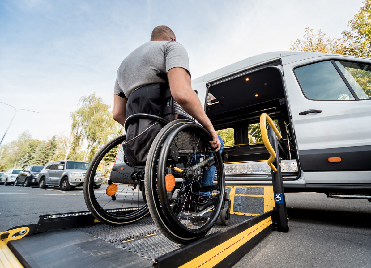 A wheelchair secured inside an accessible maxi taxi