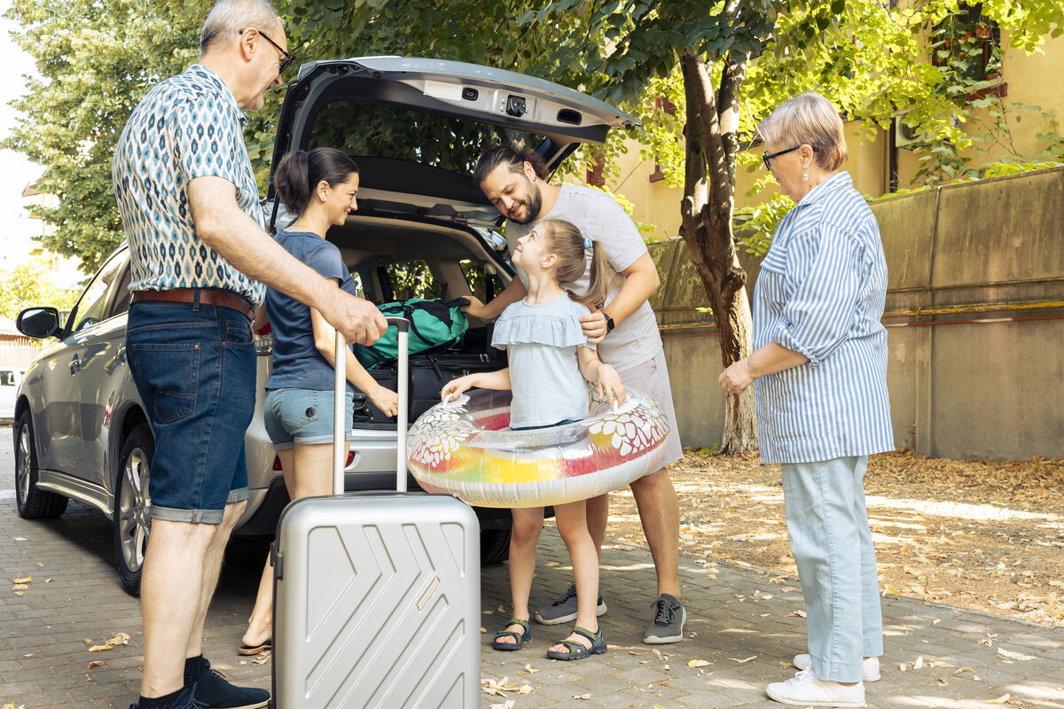 A family packing the boot of a car for a day out