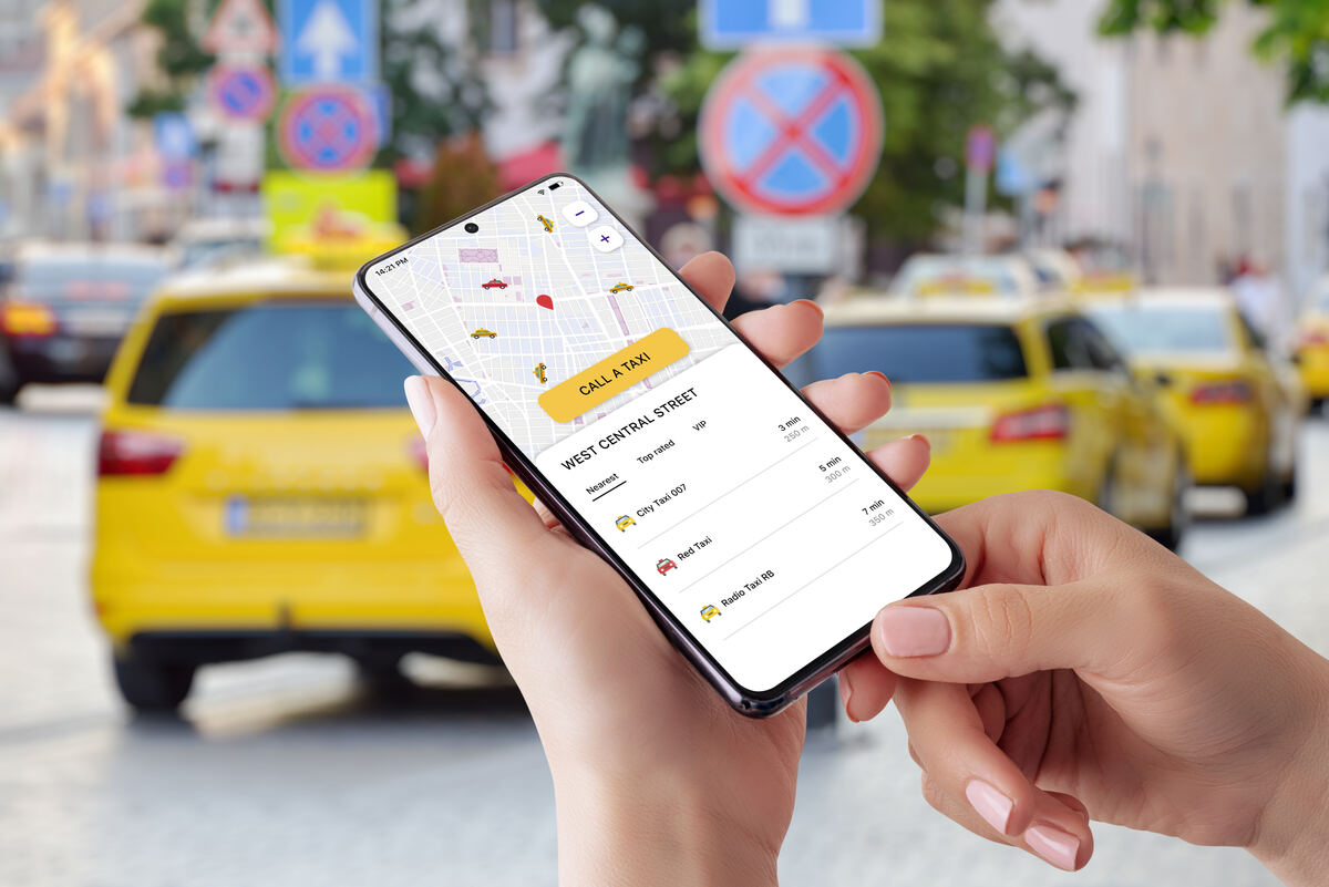 A traveller confirming a fixed-price airport taxi booking