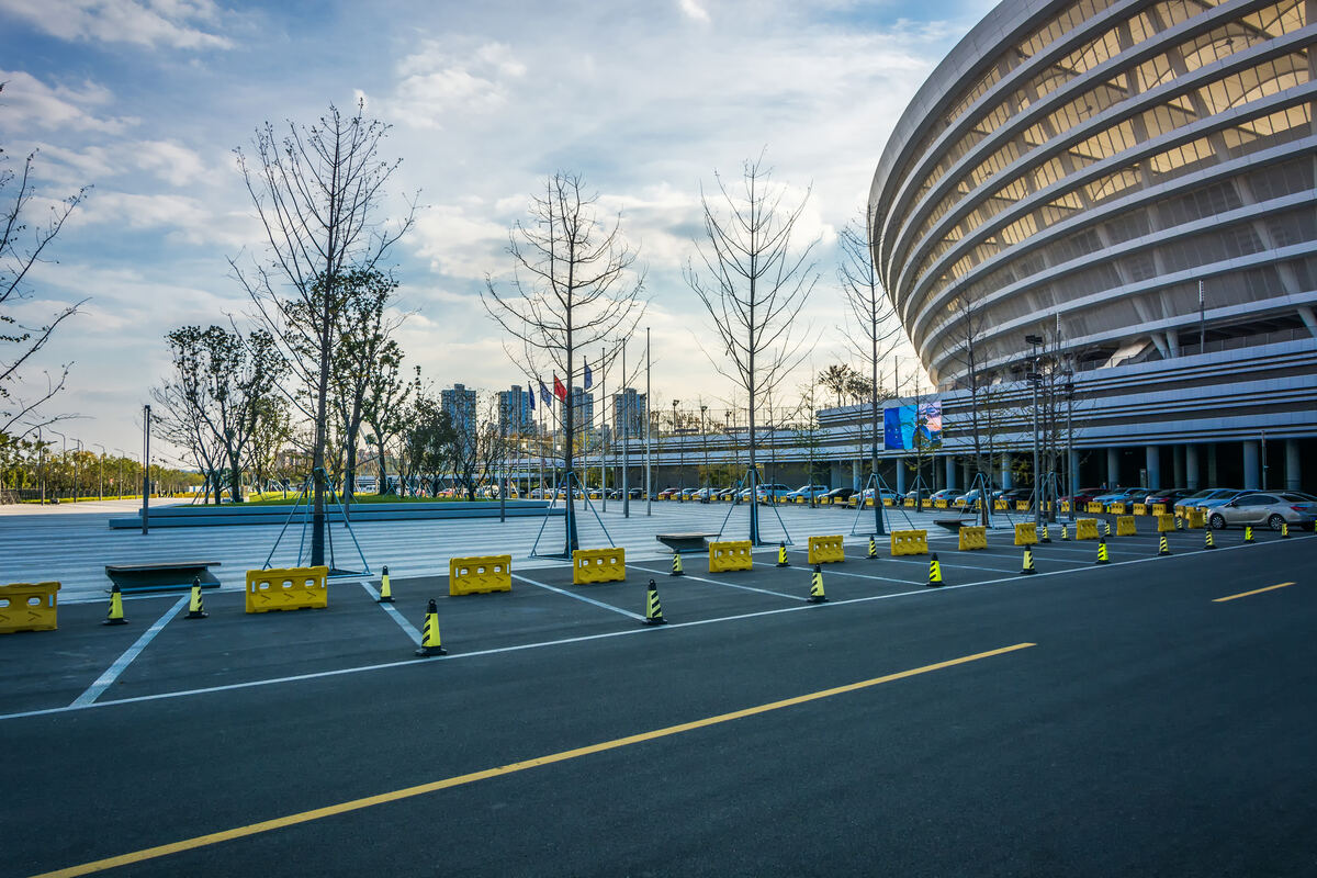 Marked taxi pickup bays outside a large terminal building