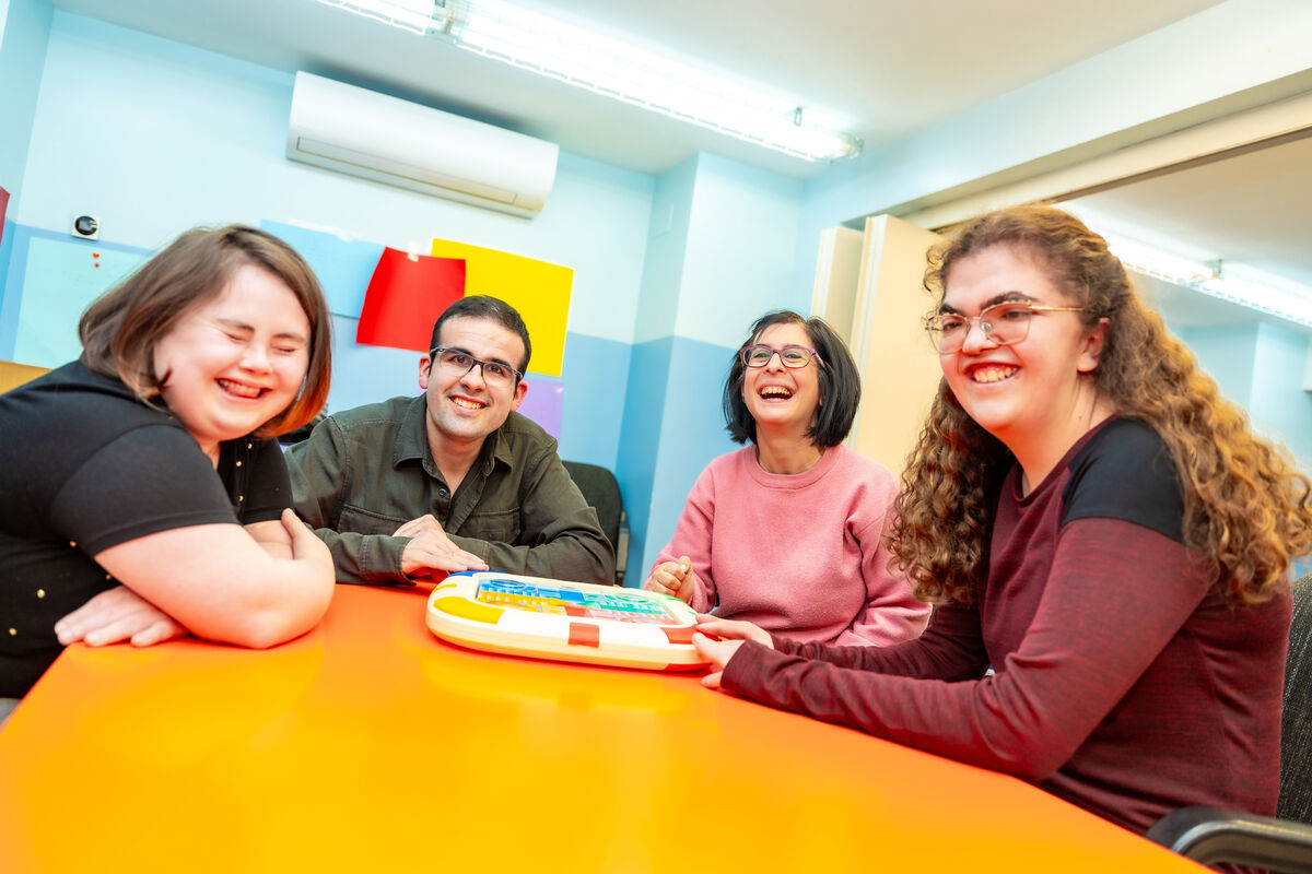 Participants around a table together at a day program